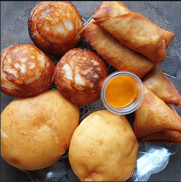 Vitumbua and mandazi served with tea